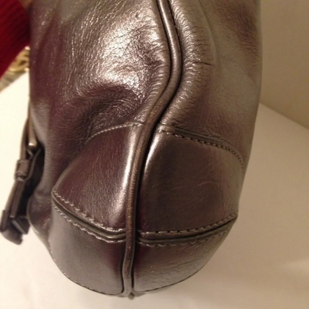 Michael Kors silver metallic hobo bag buckle